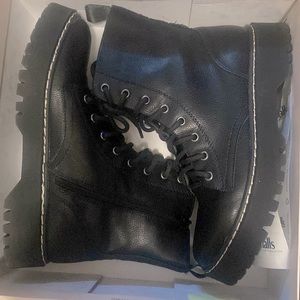 Black lace up ankle boots by Sincerely Jules